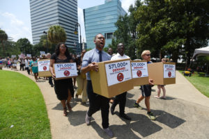 COLUMBIA, S.C. - JULY 7: Activists deliver boxes of MoveOn petitions to take down the Confederate flag in front of the Statehouse on July 7, 2015 in Columbia, South Carolina. (Photo by Rainier Ehrhardt/Getty Images for MoveOn.org)