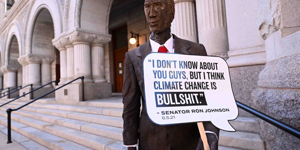 The art piece that highlights Senator Ron Johnson's views on climate change is being unveiled during MoveOn Press Conference and Rally on September 29, 2022 in Milwaukee, Wisconsin. In response to Senator Johnson calling climate change “bullsh*t,” activists with MoveOn and Next Gen PAC rallied outside of Johnson's downtown Milwaukee office to unveil a life-size statue of Johnson made of literal BS, a manure-based fertilizer. The groups hope to engage climate-conscious voters to defeat Johnson's reelection bid in November.