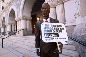 The art piece that highlights Senator Ron Johnson's views on climate change is being unveiled during MoveOn Press Conference and Rally on September 29, 2022 in Milwaukee, Wisconsin. In response to Senator Johnson calling climate change “bullsh*t,” activists with MoveOn and Next Gen PAC rallied outside of Johnson's downtown Milwaukee office to unveil a life-size statue of Johnson made of literal BS, a manure-based fertilizer. The groups hope to engage climate-conscious voters to defeat Johnson's reelection bid in November.